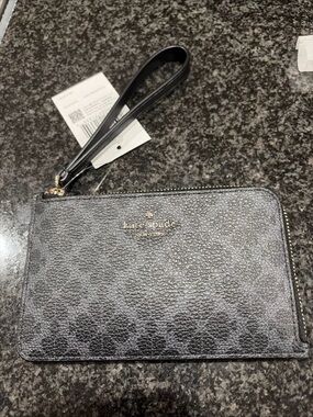 kate spade metallic charcoal wristlet clutch with gold logo